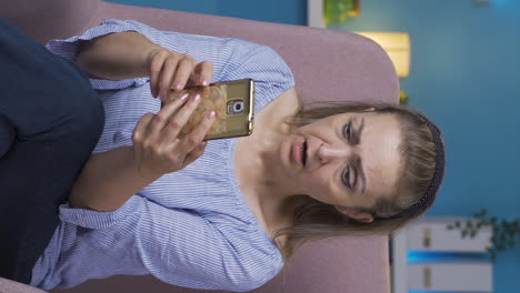 Vertical-video-of-Woman-getting-breakup-texting-gets-upset.